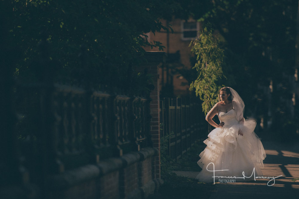 Toronto journalistic wedding photographer with dramatic light for bride portrait Journalistic wedding photography in Toronto streets