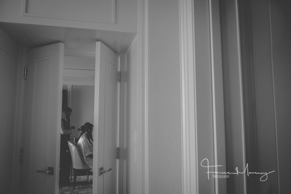 bride getting ready is large hotel room with a lot of clutter and mess The Ritz Wedding Photographer-7652