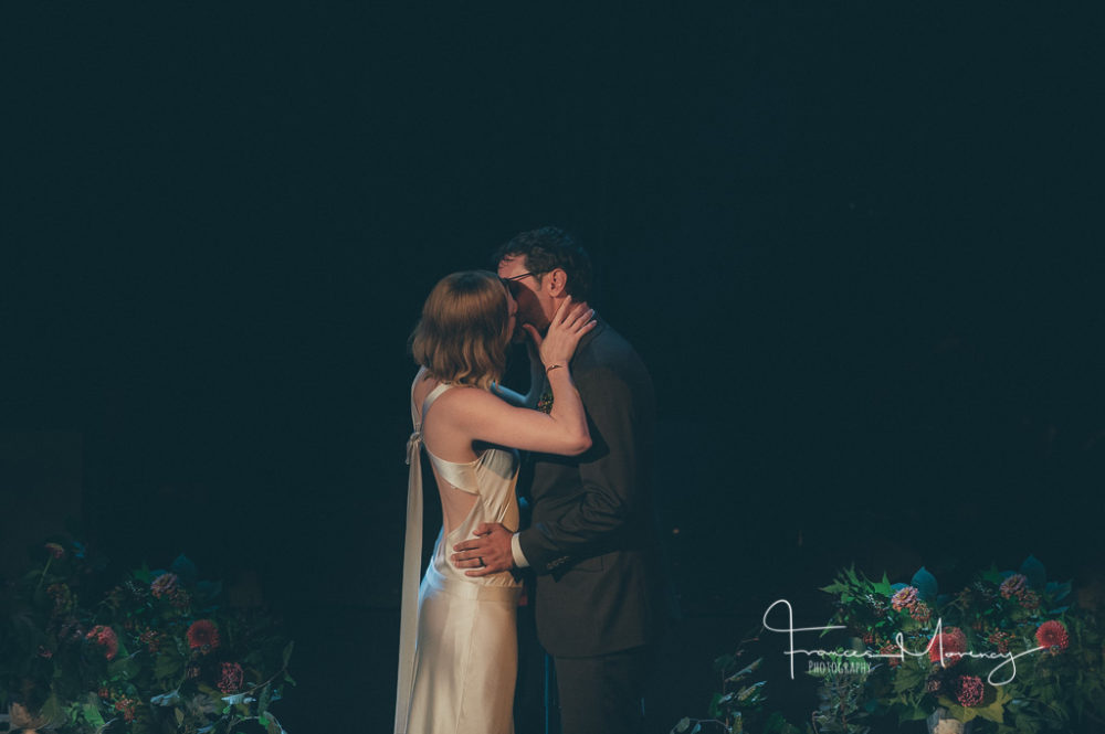 the first kiss on stage at The Opera House in Toronto Journalistic Wedding Photographer-6337