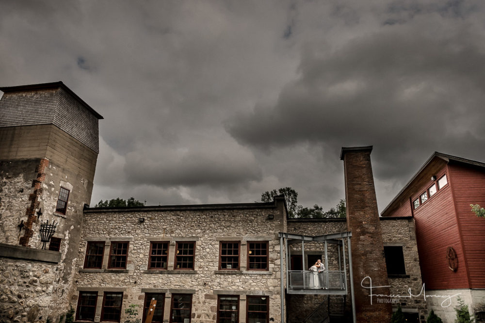 historic mill portrait with bride and groom