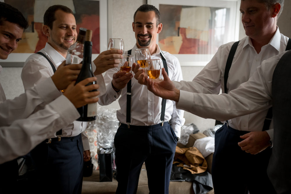 groomsmen toast with scotch at preparations