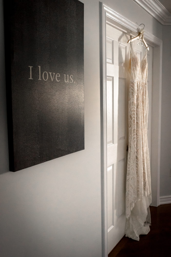the dress hung in good in hallway with window light