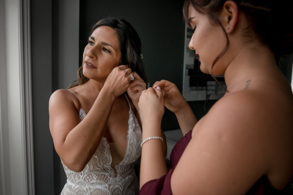 bride and daughter in front of window bride and daughter in front of window