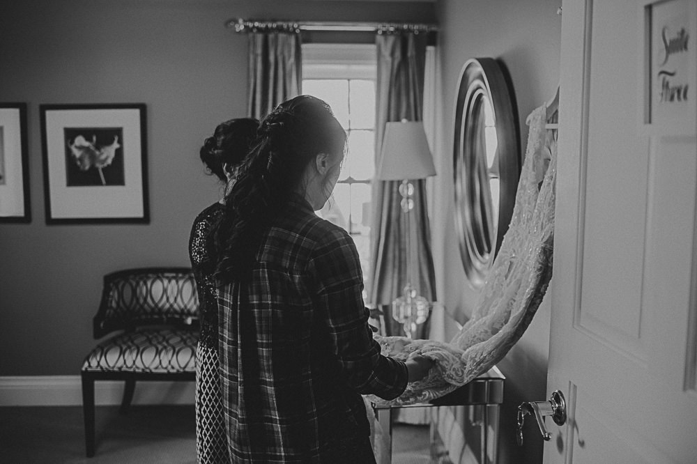 bride admiring her wedding dress