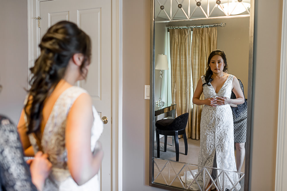 bride looking in mirror at Ancaster Mill