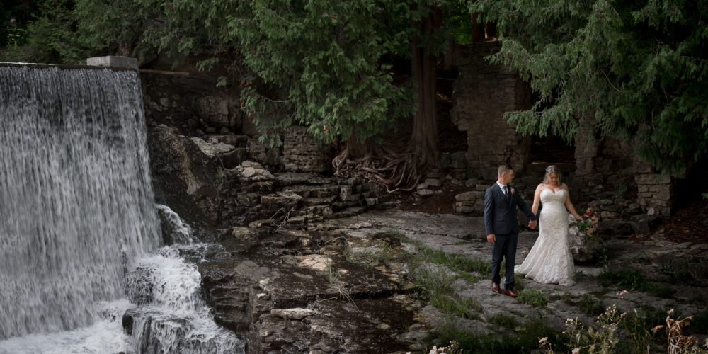 waterfalls and mill portrait with bride and groom