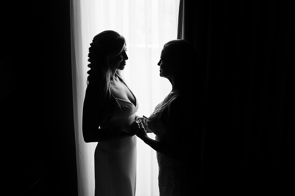 mother daughter moments in front of window
