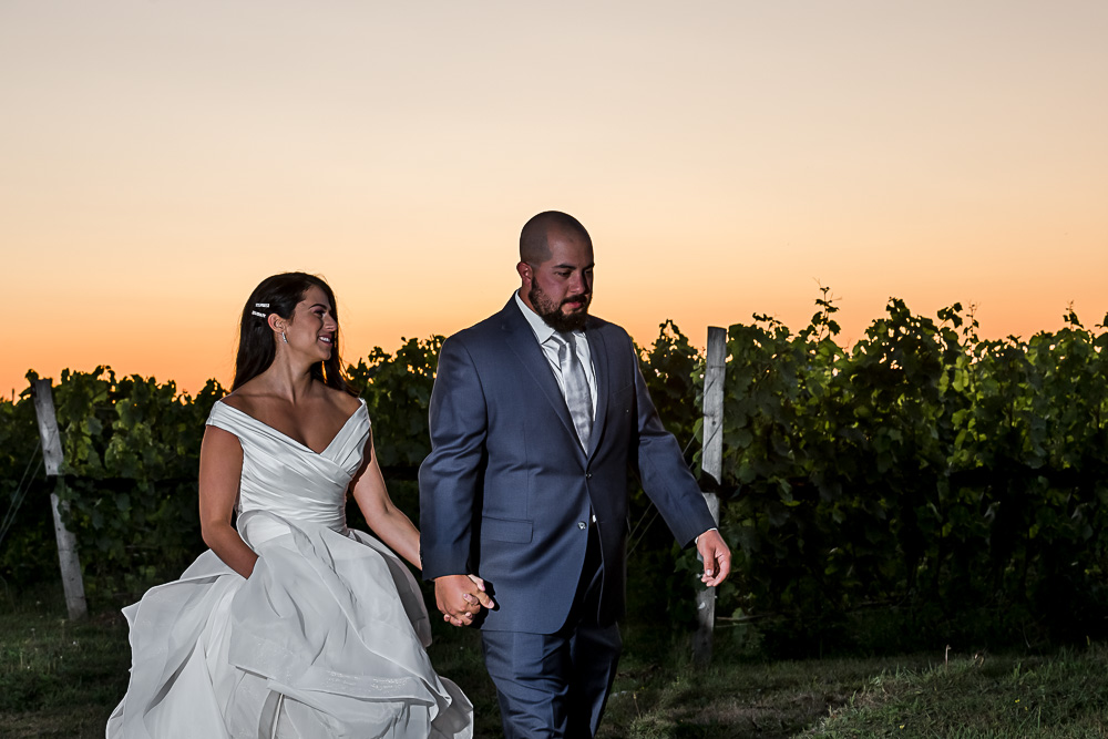 bride groom with sunset in vineyard