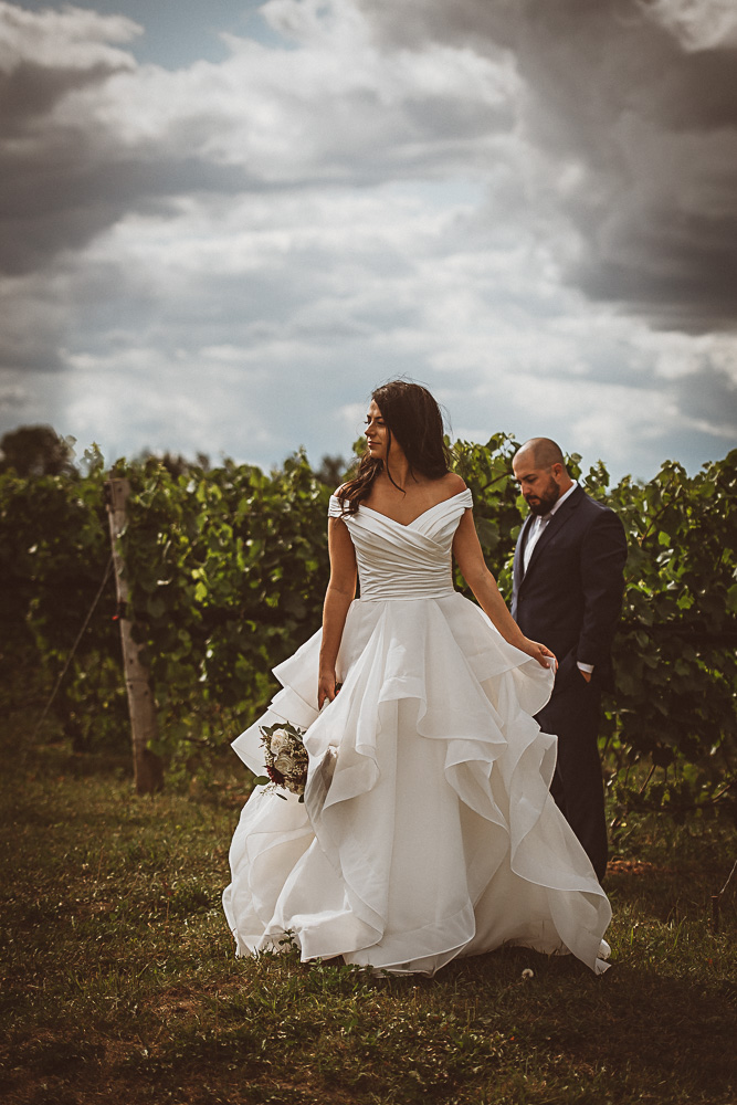 bride groom separated in vineyard