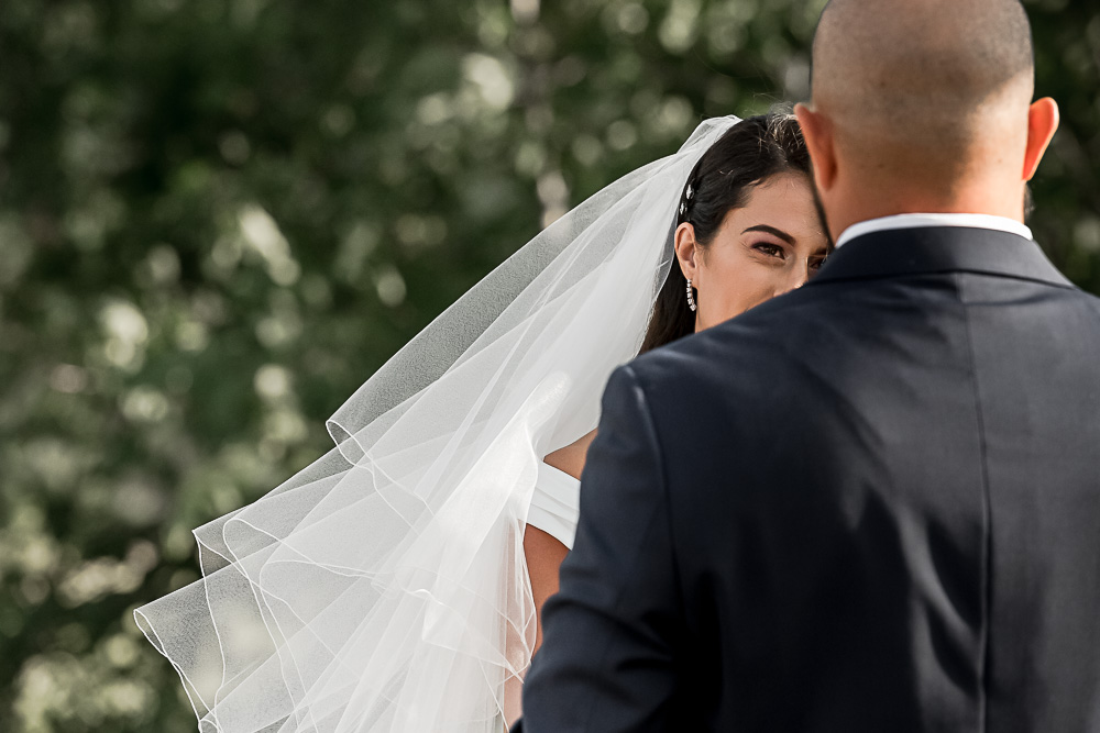 bride looking at groom during ceremony