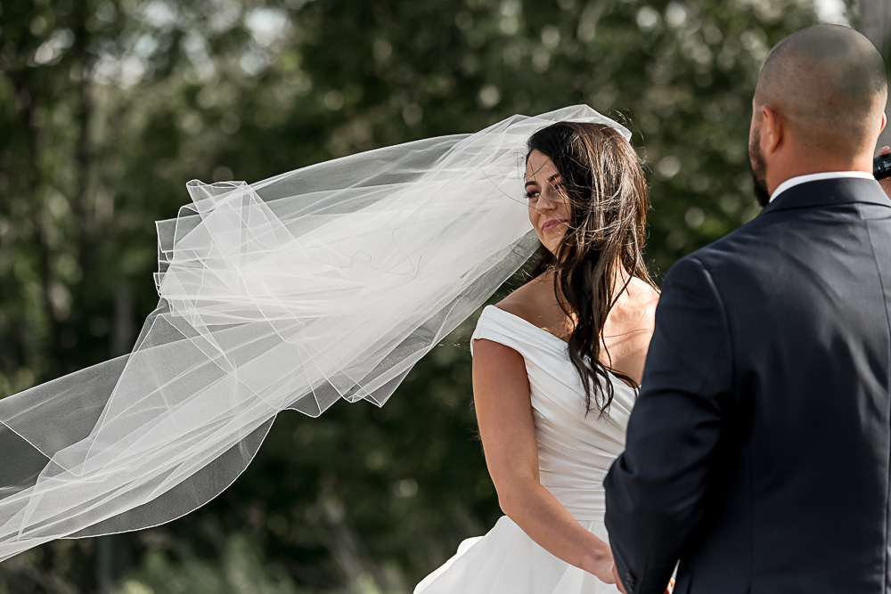 bride looking at guests during ceremony