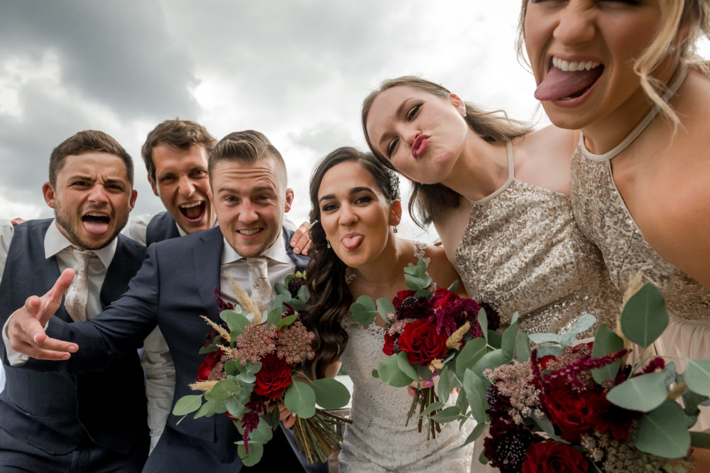 wedding party rushing the camera photo