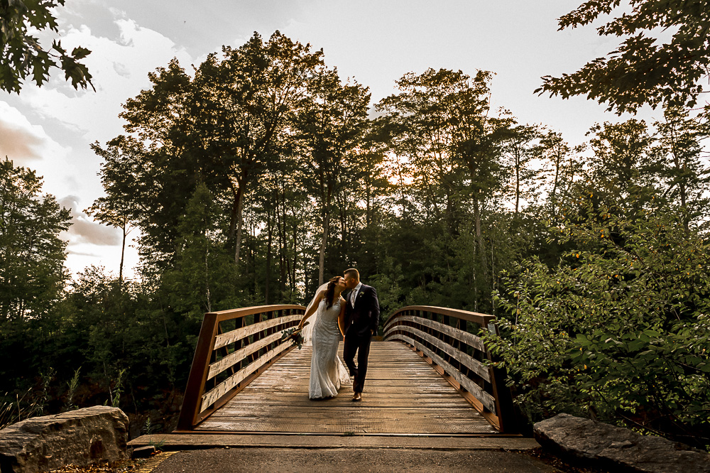bride groom walking on bridge