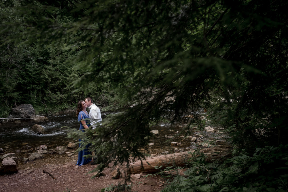 Wedding couple in forest and creek