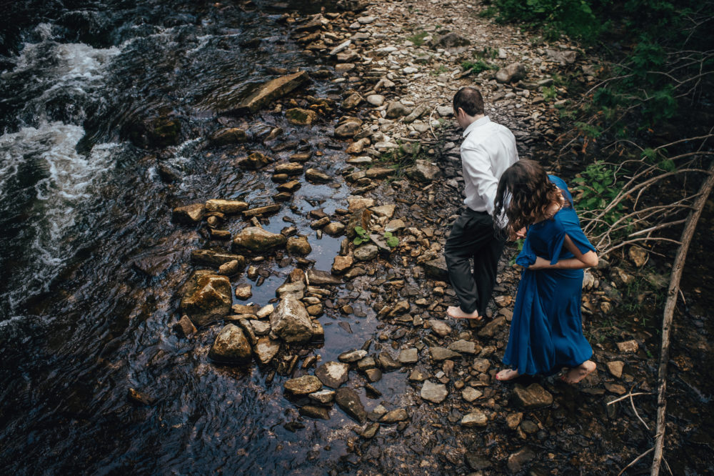 engagement couple in creek