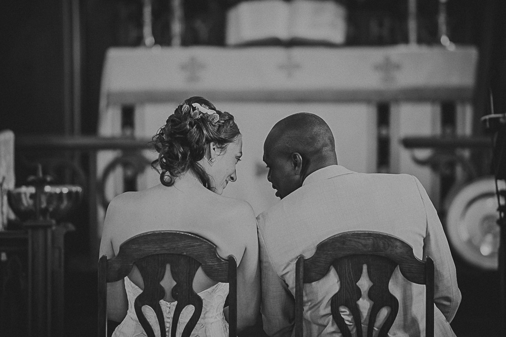 bride and groom at alter