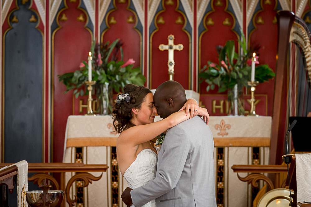 bride and groom first kiss