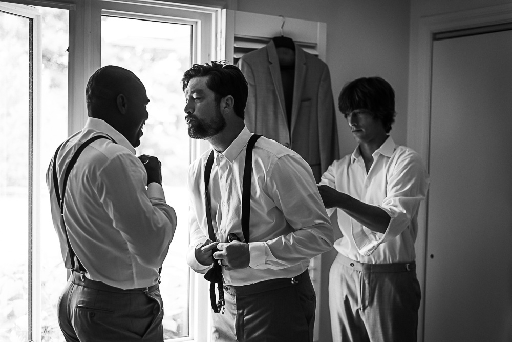 groomsmen blowing a kiss to groom