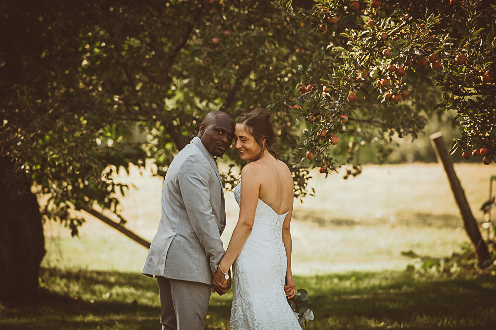 bride groom in apple orchard
