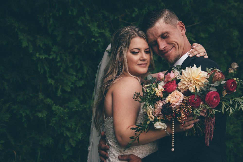 Bride groom portrait with flower bouquet