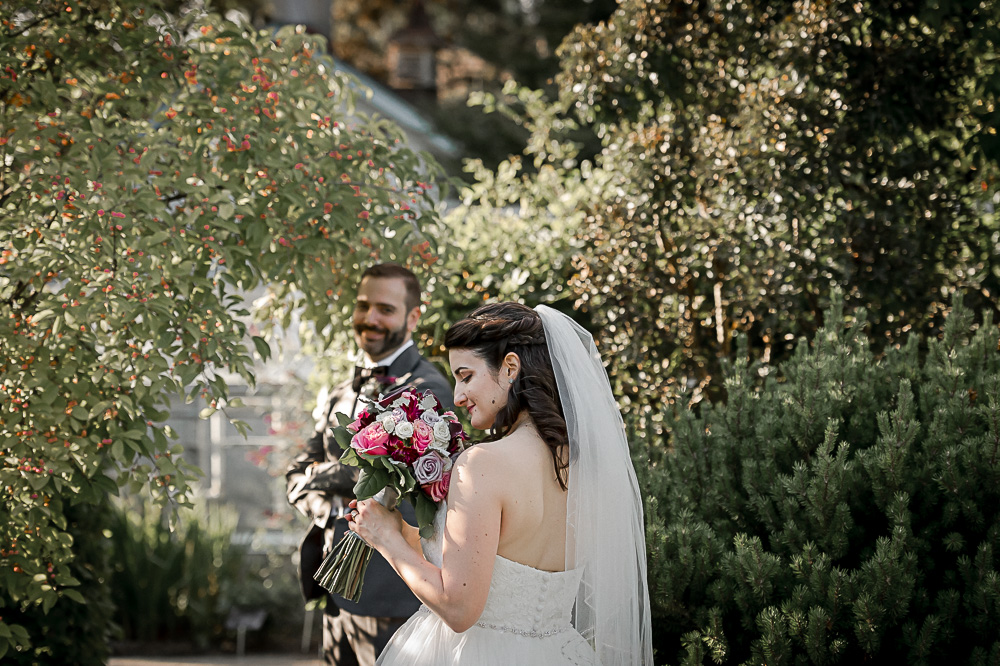 photo in front of greenhouse with bride groom