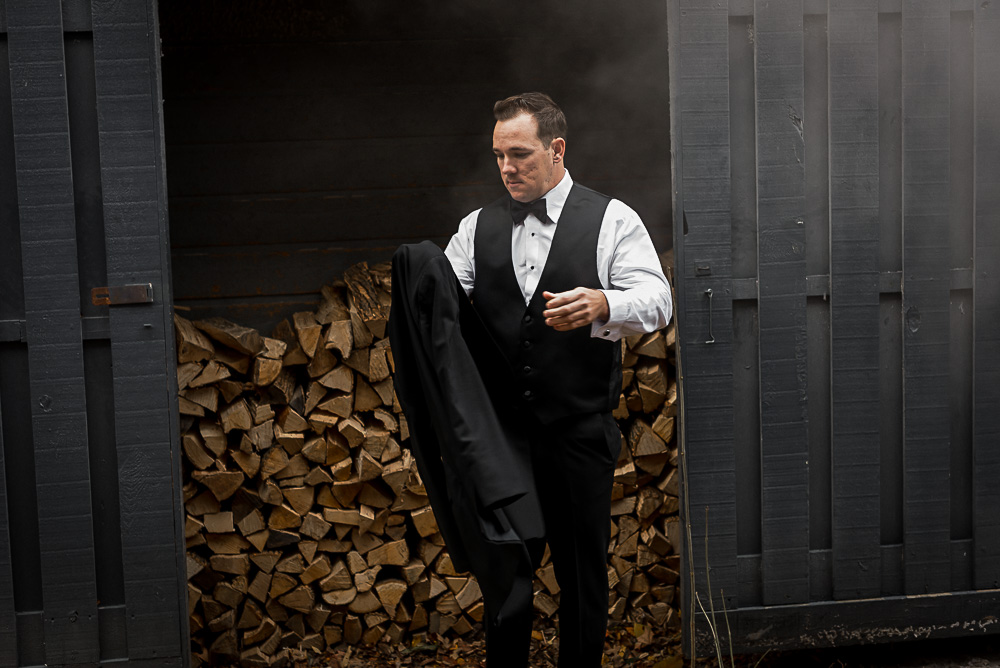 groom in black tux at Millcroft