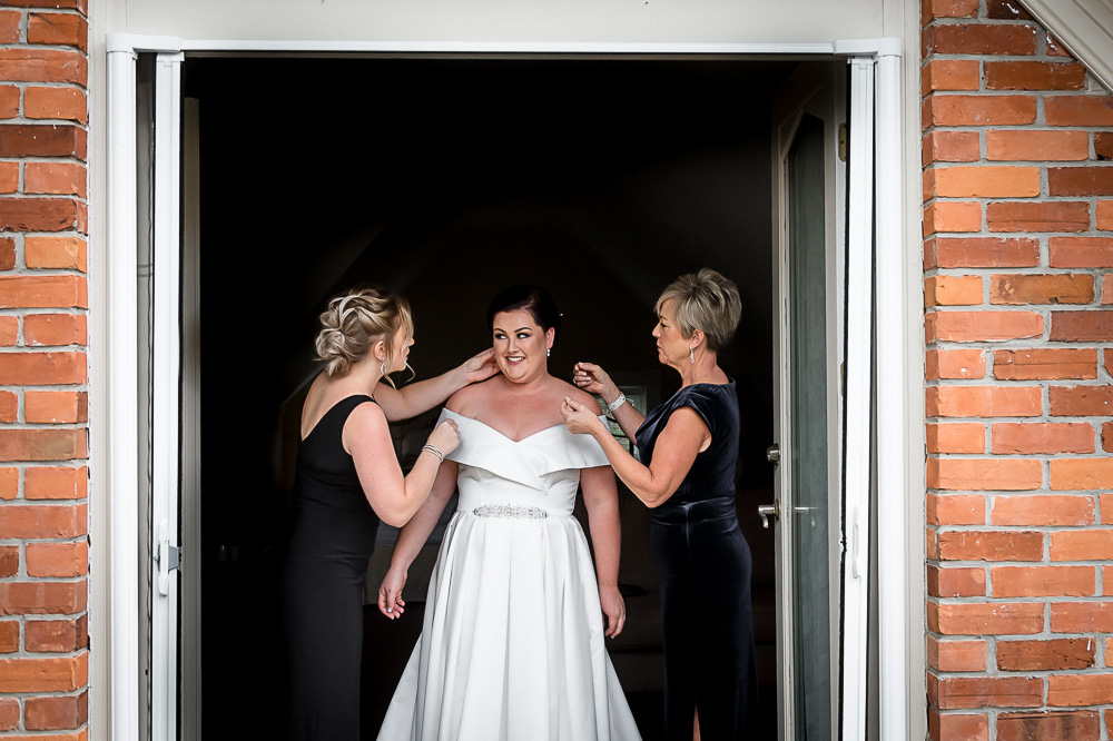 bride getting accessories put on