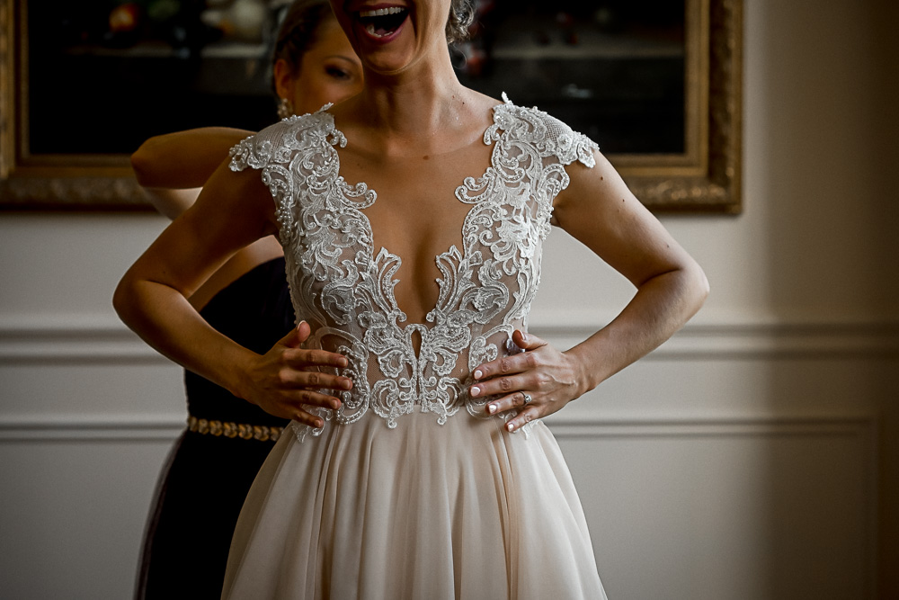 bride touching her dress