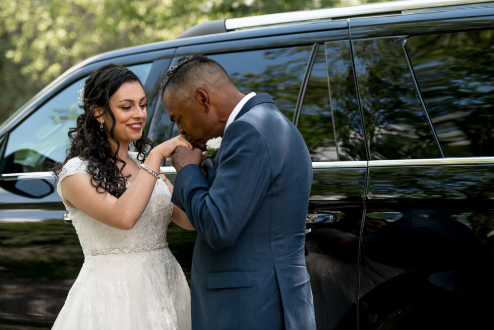 dad kissing bride's hand