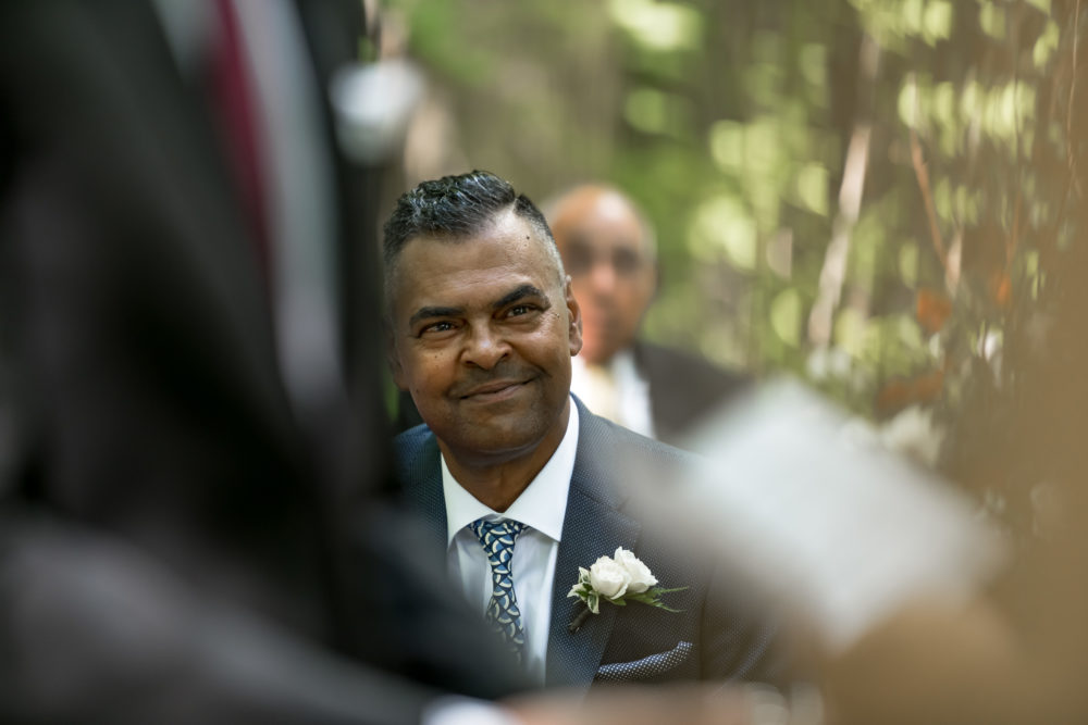 dad listening to vows at ceremony