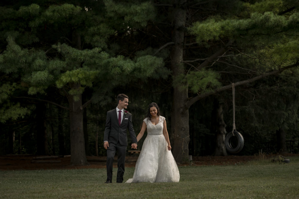 bride groom walking out of woods