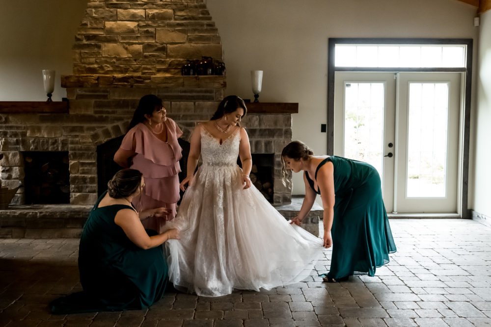 bridesmaids helping bride at the special events centre