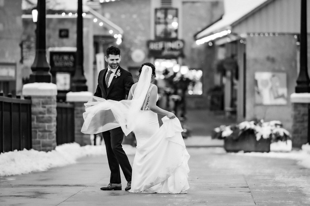 bride groom dancing on bridge in elora