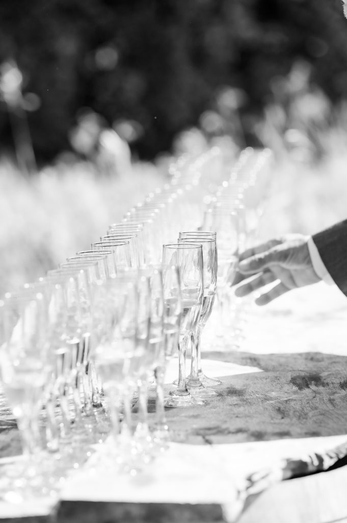 guests receiving champagne before wedding ceremony