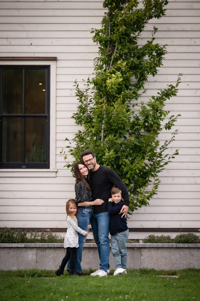 family photos with house as backdrop
