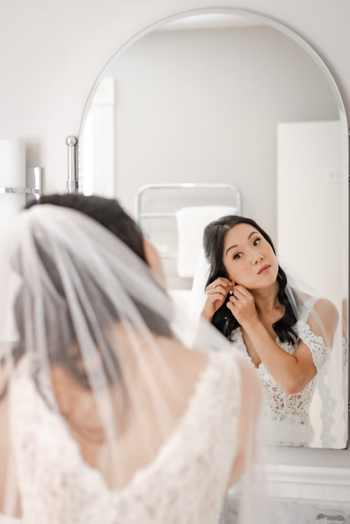 bride looking in mirror