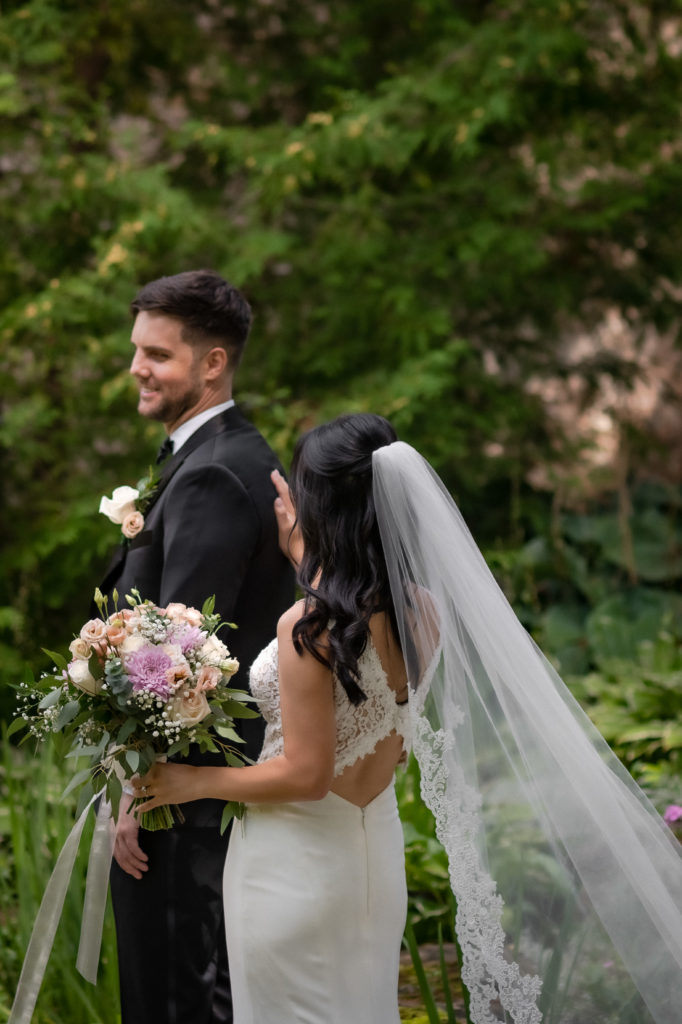 bride taps groom on shoulder