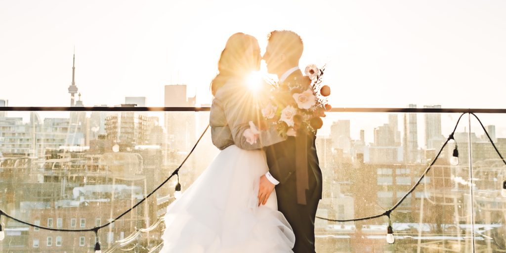 golden hour wedding photos with sun flare