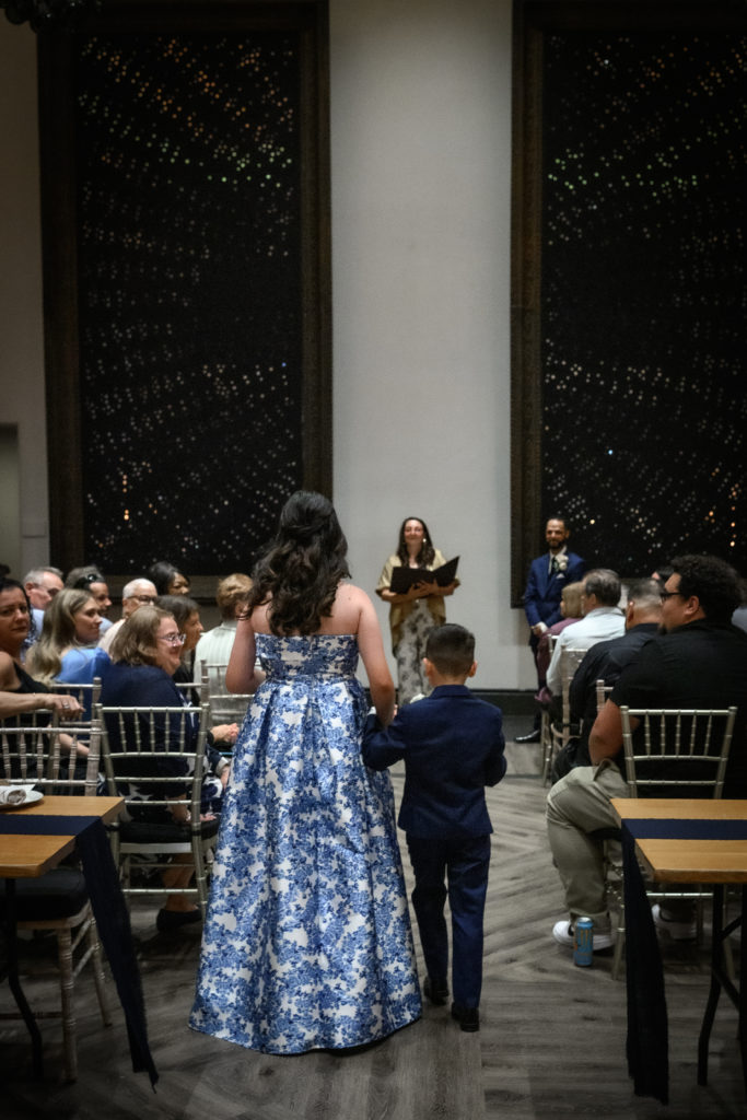 children walking up the aisle during ceremonyd at Terroni